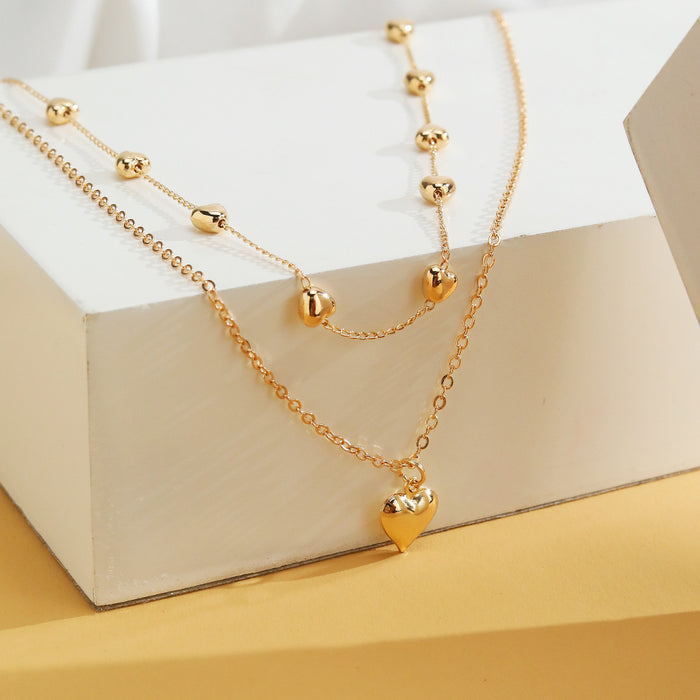 Collier Double Rang Pendentif Cœur — Doré porté